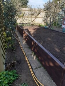 Raised bed created with scaffold boards