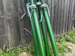 Four green Size 2 acrow props (1.98m–3.35m) ready for sale