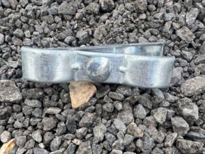 Side view of Heras temporary fencing clip with hex bolt and nut