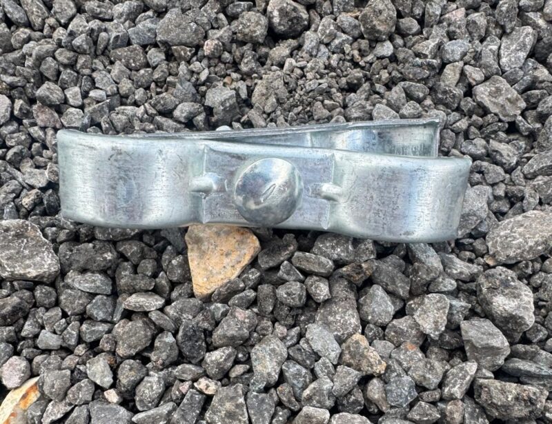 Side view of Heras temporary fencing clip with hex bolt and nut