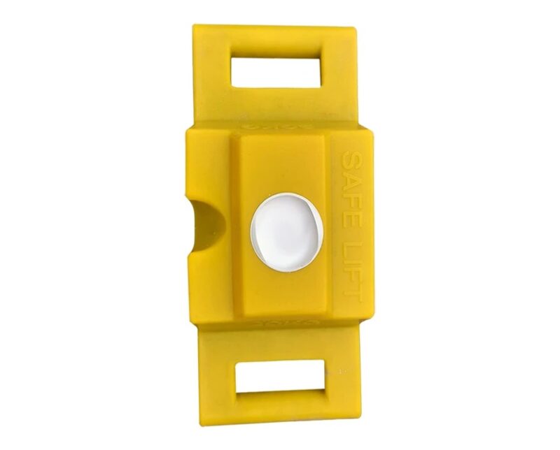 Bright yellow 20kg Safe Lift ballast blocks stacked on temporary fencing for wind stability and safe one-person lifting