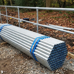 26-9mm x 2 5mm galvanised steel handrail tube bundle Bundle of 26.9mm x 2.5mm galvanised steel handrail tubes stacked on a construction site