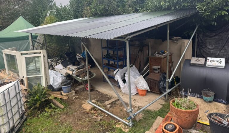 Temporary builders shelter built from used scaffold tube and new couplers near Petersfield