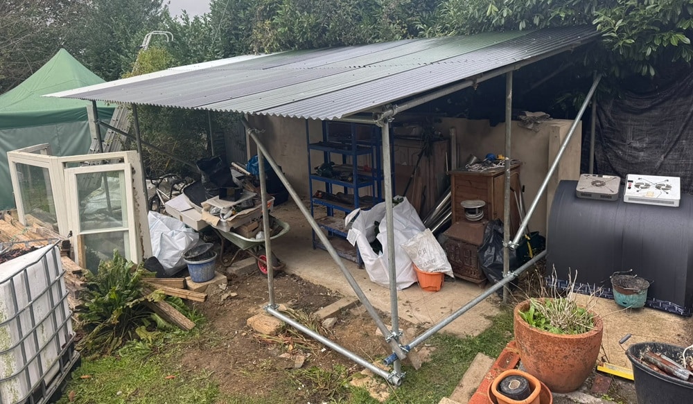 Temporary builders shelter built from used scaffold tube and new couplers near Petersfield